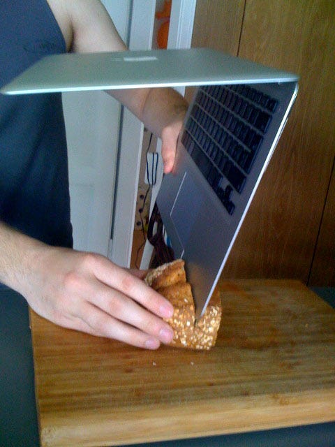 cutting bread with a MacBook