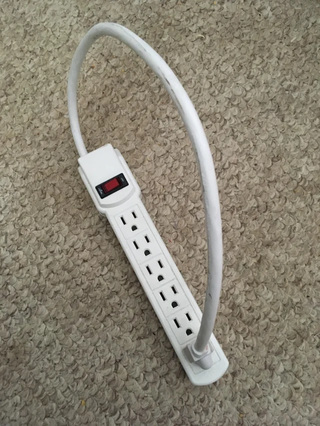 surge protector strip owned by a genius generating unlimited power (strip plugged into itself)